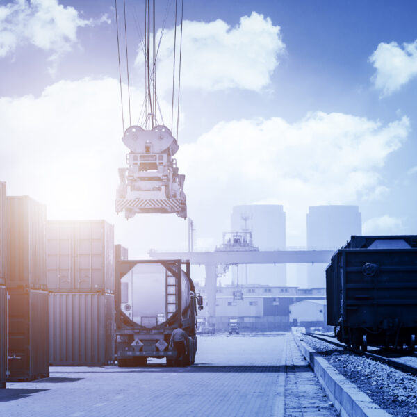 Industrial crane loading Containers in a Cargo freight ship